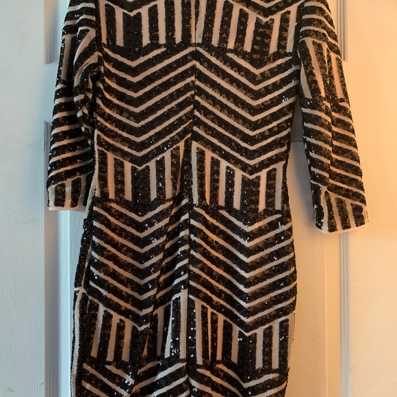 Super cute mini dress! Nude color with black beading. Adorable for a night out! - Picture 2 of 4